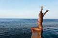 Woman at infinity swimming pool with sea view Royalty Free Stock Photo