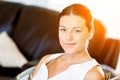 Happy woman reading a magazine sitting on a sofa Royalty Free Stock Photo