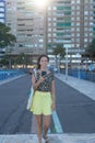 Happy woman reading and writing and sending an email with optimistic attitude using a device. Caucasian Teen Girl with yellow