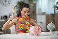 Happy woman ready to break piggy bank Royalty Free Stock Photo