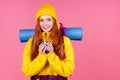 Happy woman ready to hiking in unknown place she is carries big backpack on shoulders in pink studio background