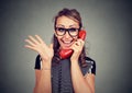 Happy young woman receiving good news winning on the phone Royalty Free Stock Photo