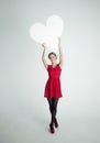 Happy Woman in Red Dress Holding White Blank Heart Banner Royalty Free Stock Photo