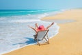 Happy woman in red sunhat on the beach Royalty Free Stock Photo