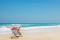 Happy woman in red sunhat on the beach Royalty Free Stock Photo