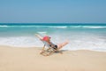 Happy woman in red sunhat on the beach Royalty Free Stock Photo