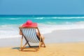 Happy woman in red sunhat on the beach Royalty Free Stock Photo