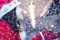 Happy woman in ref clothes with snow at night. Merry Christmas concept Royalty Free Stock Photo