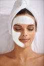 Happy woman, relax and face mask at spa for skincare, beauty or makeup cosmetics at hotel or resort. Calm female person Royalty Free Stock Photo