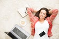 Happy Woman Relax at Home with Laptop and Phone. Young Girl have Coffee Break. Student Lying Down Hands behind Head on White Royalty Free Stock Photo