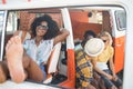 Happy woman relaxing in camper van