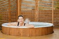 Happy woman relaxing in hot tub Royalty Free Stock Photo