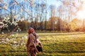 Happy woman relaxing in spring garden. Senior woman walking in field. Lady enjoying life Royalty Free Stock Photo