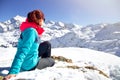 Happy woman relaxing on the top of mountain under blue sky with sunlight at sunny winter day, travel vacation, landscape mountains