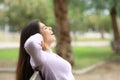 Happy woman resting on a bench Royalty Free Stock Photo