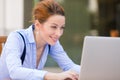 Happy woman resting hands on keyboard, looking on computer laptop screen Royalty Free Stock Photo