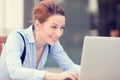 Happy woman resting hands on keyboard, looking on computer laptop screen Royalty Free Stock Photo