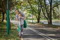 Happy woman riding on an e-scooter with her son. Young and beautiful caucasian woman rides electric scooter with boy in Royalty Free Stock Photo