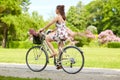 Happy woman riding fixie bicycle in summer park Royalty Free Stock Photo