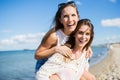 Happy woman riding piggyback on her best friend Royalty Free Stock Photo