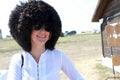 Happy woman in Russian papakha hat