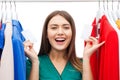 Happy woman with sale tags on clothes at wardrobe Royalty Free Stock Photo