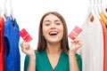 Happy woman with sale tags on clothes at wardrobe Royalty Free Stock Photo