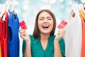 Happy woman with sale tags on clothes at wardrobe Royalty Free Stock Photo