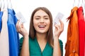 Happy woman with sale tags on clothes at wardrobe Royalty Free Stock Photo