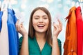 Happy woman with sale tags on clothes at wardrobe Royalty Free Stock Photo