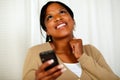 Happy woman sending a text message by the mobile Royalty Free Stock Photo