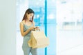 Happy woman with shopping bags enjoying in shopping and using sm