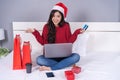 Happy woman shopping online for Christmas gift with computer lap Royalty Free Stock Photo