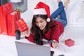 Happy woman shopping online for Christmas gift with computer lap Royalty Free Stock Photo