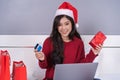 Happy woman shopping online for Christmas gift with computer lap Royalty Free Stock Photo