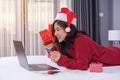 Happy woman shopping online for Christmas gift with computer lap Royalty Free Stock Photo