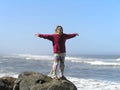 Happy woman on the shore of the ocean Royalty Free Stock Photo