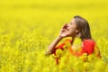 Woman shouting in a yellow field