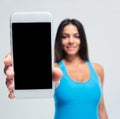 Happy woman showing blank smartphone screen Royalty Free Stock Photo