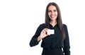 Happy woman showing business card studio. Businesswoman smiling with blank bank card Royalty Free Stock Photo