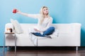 Happy woman showing cup of tea Royalty Free Stock Photo