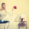 Happy woman showing cup of tea Royalty Free Stock Photo