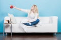 Happy woman showing cup of tea Royalty Free Stock Photo