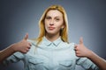 Happy woman showing thubs up. Closeup Portrait girl smiling isolated on grey Royalty Free Stock Photo