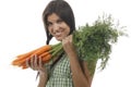 Happy woman shows on a bunch of carrots Royalty Free Stock Photo