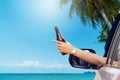 Happy woman sitting in the car and traveling summer season on the sea Royalty Free Stock Photo