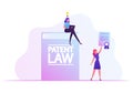 Happy Woman Sitting on Huge Patent Law Book Working on Laptop with Glowing Light Bulb over Head