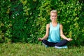 Happy woman sitting in siddhasana yoga pose Royalty Free Stock Photo