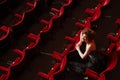 Happy Woman Sitting In Theatre Stall Royalty Free Stock Photo