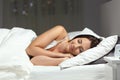 Happy woman sleeping on the bed in the night Royalty Free Stock Photo